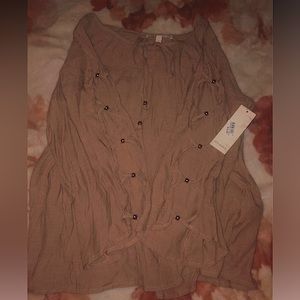 Brown Long-sleeve. Thin with slit arm detail.